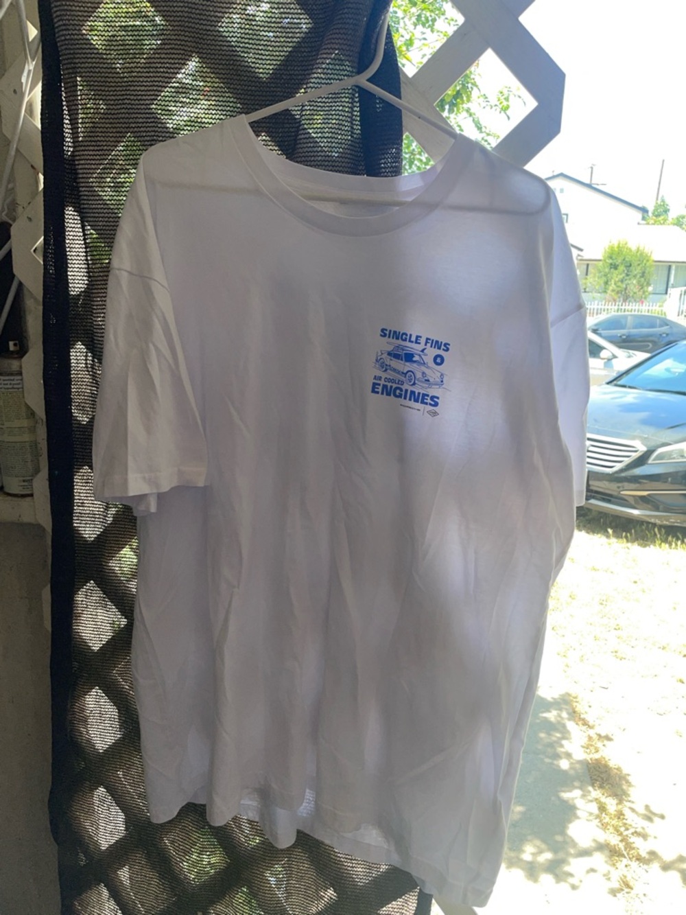 White Graphic Tee with Blue 'Single Fins Engines' Logo